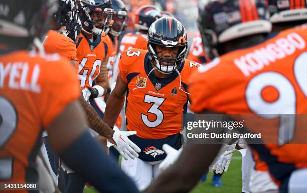 Russell Wilson of the Denver Broncos takes the field during a game `az at Empower Field At Mile High on October 06, 2022 in Denver, Colorado.