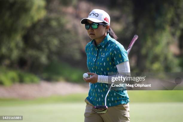 Ayako Uehara of Japan holds her ball while leaving the sixth hole during the first round of the LPGA MEDIHEAL Championship at The Saticoy Club on...