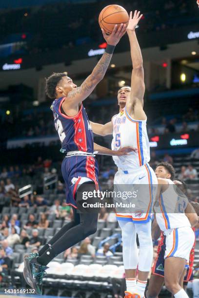 Craig Randall II of the Adelaide 36ers shoots past Darius Bazley of the Oklahoma City Thunder during the second quarter at Paycom Center on October...