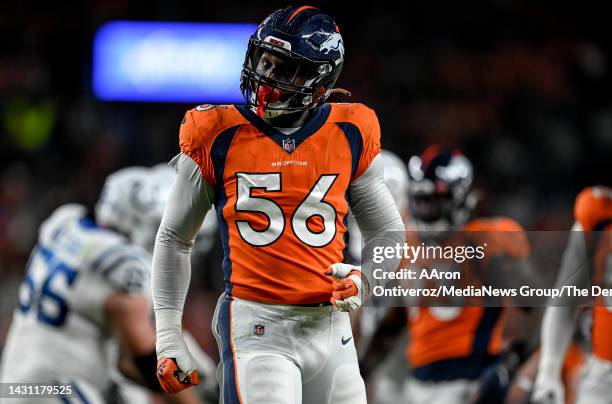 Baron Browning of the Denver Broncos reacts to sacking Matt Ryan of the Indianapolis Colts during the second quarter at Empower Field at Mile High in...