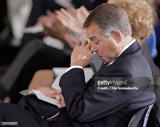 Speaker of the House John Boehner wipes away tears during the National Commermoration of the Day of Rememberance observance in the Rotunda of the...