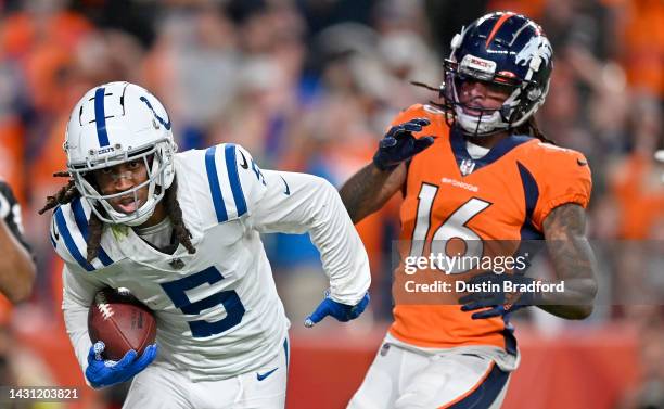 Stephon Gilmore of the Indianapolis Colts intercepts a pass in the fourth quarter during a game against the Denver Broncos at Empower Field At Mile...