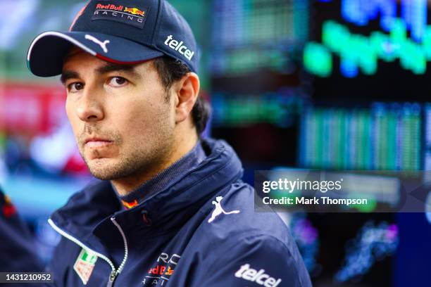 Sergio Perez of Mexico and Oracle Red Bull Racing looks on in the garage during practice ahead of the F1 Grand Prix of Japan at Suzuka International...