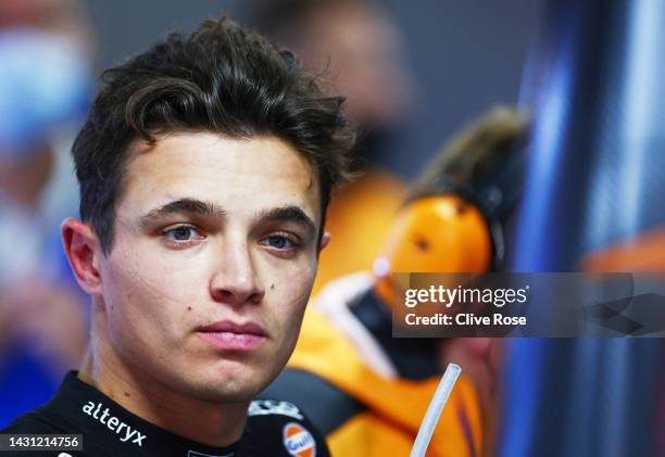 Lando Norris of Great Britain and McLaren looks on in the garage during practice ahead of the F1 Grand Prix of Japan at Suzuka International Racing...