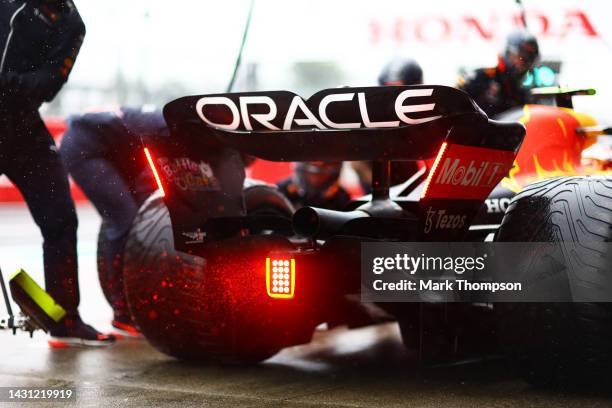 Sergio Perez of Mexico driving the Oracle Red Bull Racing RB18 makes a pitstop during practice ahead of the F1 Grand Prix of Japan at Suzuka...