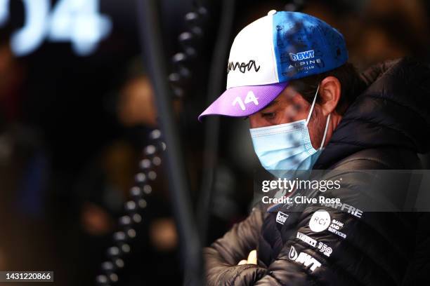 Fernando Alonso of Spain and Alpine F1 looks on in the garage during practice ahead of the F1 Grand Prix of Japan at Suzuka International Racing...