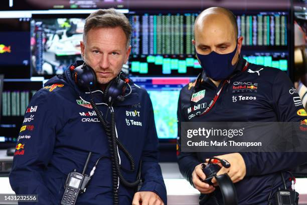 Red Bull Racing Team Principal Christian Horner and Red Bull Racing race engineer Gianpiero Lambiase look on, in the garage during practice ahead of...