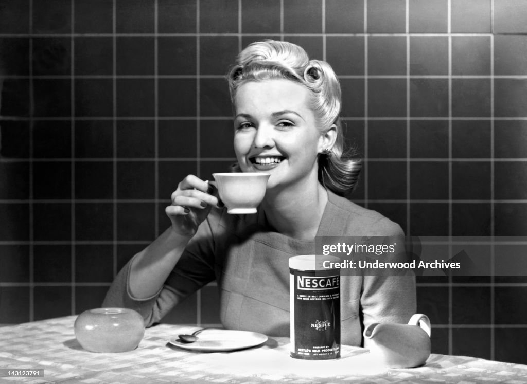 Woman Drinking Nescafe