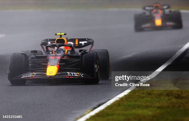 Sergio Perez of Mexico driving the Oracle Red Bull Racing RB18 leads Max Verstappen of the Netherlands driving the Oracle Red Bull Racing RB18 during...