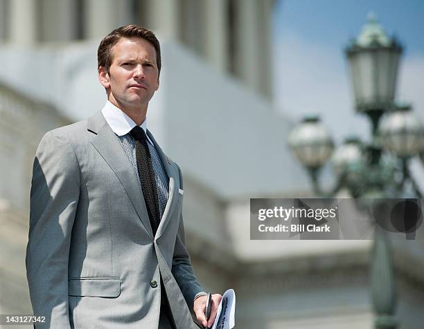 Rep. Aaron Schock, R-Ill., walks down the House steps following a series of votes on Thursday, April 19, 2012.