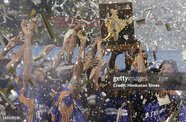 The Rajasthan Royals team celebrate with the IPL trophy after their win over Chennai in the final of IPL 1 at D.Y. Patil stadium on June 1, 2008 in...