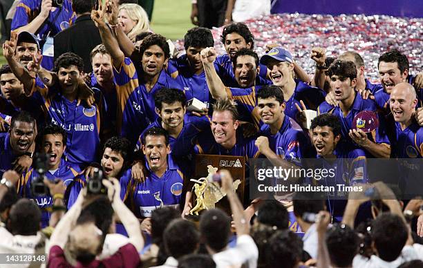 The Rajasthan Royals team celebrate with the IPL trophy after their win over Chennai in the final of IPL 1 at D.Y. Patil stadium on June 1, 2008 in...