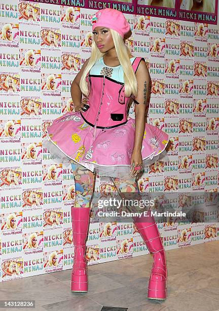 Nicki Minaj signs copies of her number one album 'Pink Friday: Roman Reloaded' at HMV Whiteleys on April 19, 2012 in London, England.