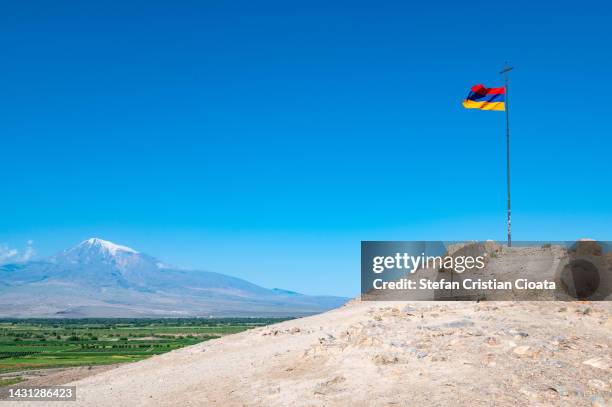 mount ararat and armenian flag in khor virap, armenia - armenian church stock pictures, royalty-free photos & images