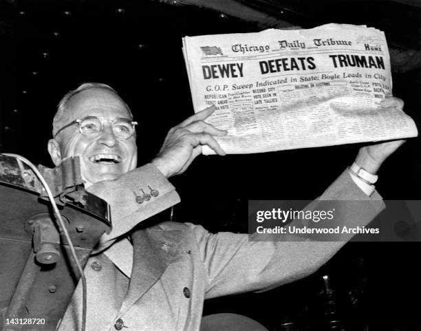 President Harry Truman holds up a copy of the Chicago Daily Tribune declaring his defeat to Thomas Dewey in the presidential election, St Louis,...