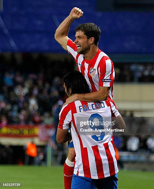 Radamel Falcao of Atletico Madrid celebrates with team mate Diego Ribas after scoring the opening goal during the UEFA Europa League Semi Final first...