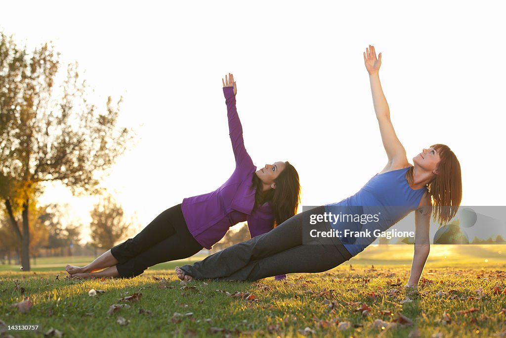 Women in yoga pose.