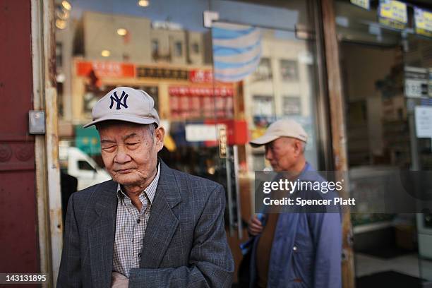 An elderly man pauses while walking down a street April 19, 2012 in the Chinatown neighborhood of New York City. According to an analysis by the...