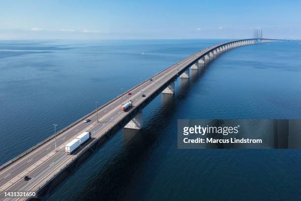 transportation on the öresund bridge across the sea - trucks stock pictures, royalty-free photos & images
