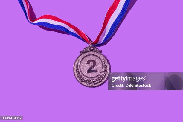 silver medal with the number 2, as the second classified, on a purple background. concept of winner, medals, honor, women's day, winning woman, working woman and sports competition. - silver medal bildbanksfoton och bilder