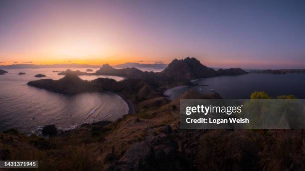 sunset over padar island - archipelago stock pictures, royalty-free photos & images