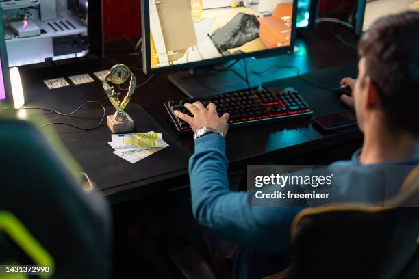 male gamer playing - gaming station stock pictures, royalty-free photos & images