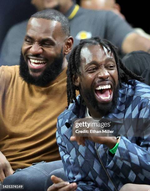 LeBron James and Patrick Beverley of the Los Angeles Lakers laugh on the bench in the fourth quarter of a preseason game against the Minnesota...