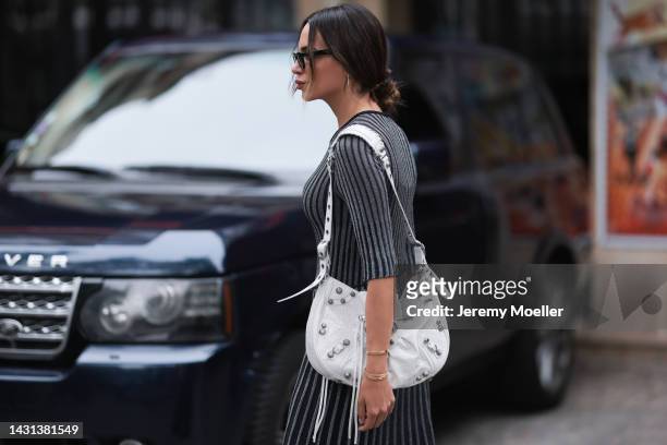 Zeynab El-helw seen wearing a balenciaga le cagole bag, outside Stella McCartney during Paris Fashion Week on October 03, 2022 in Paris, France.