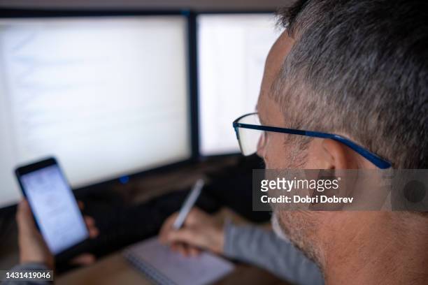 a developer writes code. - javascript stock pictures, royalty-free photos & images