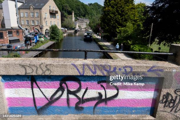 Transgender Pride flag painted onto a bridge over the Rochdale Canal on 7th June 2023 in Hebden Bridge, United Kingdom. The transgender flag is a...