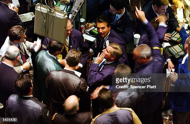 Traders work the floor of the New York Stock Exchange September 25, 2002 in New York City. The Dow Jones Industrial Average closed the day up about...