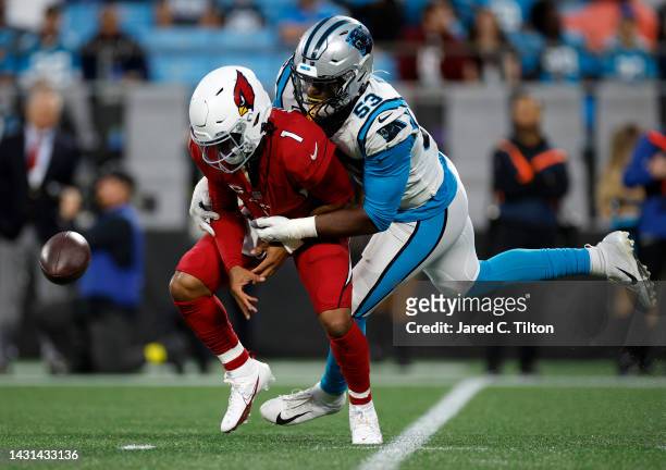Quarterback Kyler Murray of the Arizona Cardinals is sacked by defensive end Brian Burns of the Carolina Panthers during the second half of their...