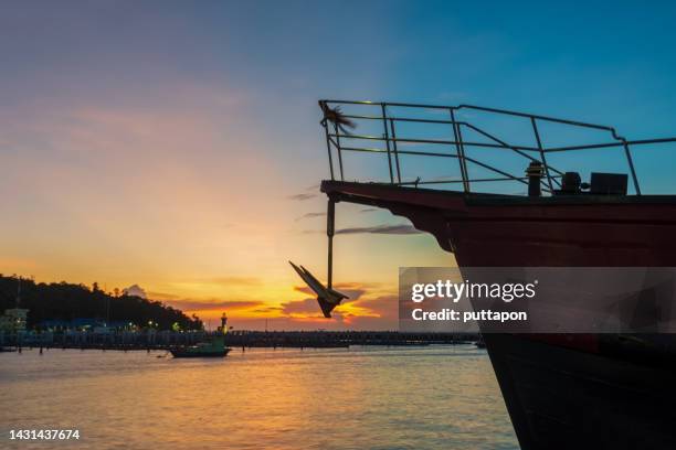 big anchor of a coastal fishing boat - boat old stock-fotos und bilder