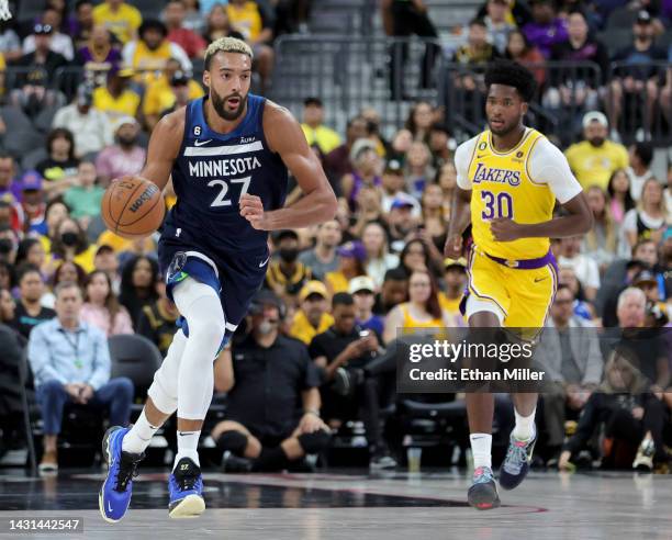 Rudy Gobert of the Minnesota Timberwolves brings the ball up the court ahead of Damian Jones of the Los Angeles Lakers in the second quarter of their...