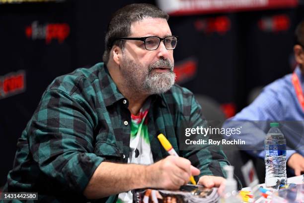 Mick Foley signs autographs during New York Comic Con 2022 on October 07, 2022 in New York City.