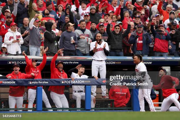 The Cleveland Guardians bench celebrates after Jose Ramirez a two RBI home run in the sixth inning against the Tampa Bay Rays during game one of the...