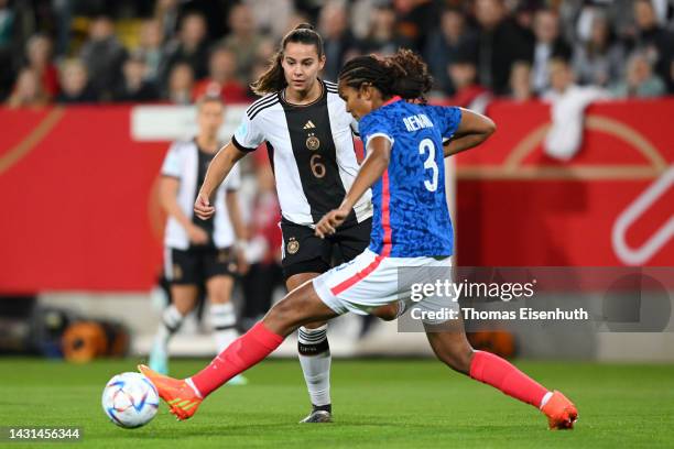 Wendie Renard of France battles for possession with Lena Oberdorf of Germany during the international friendly match between Germany Women's and...