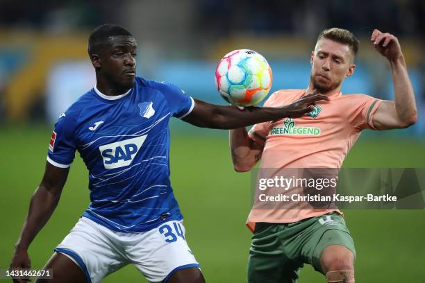 Stanley Nsoki of Hoffenheim battles for the ball with Mitchell Weiser of Werder Bremen during the Bundesliga match between TSG Hoffenheim and SV...