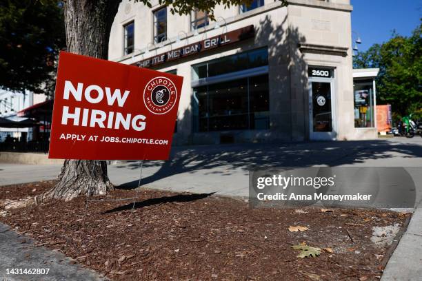 Now Hiring" sign is displayed in front of a Chipotle restaurant on October 07, 2022 in Washington, DC. The Labor Department announced that in the...