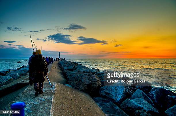 fishermen at early sunrise on sea - rolour garcia stock pictures, royalty-free photos & images