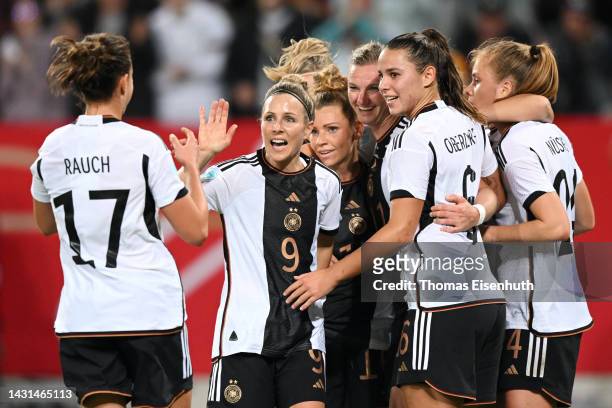 Alexandra Popp of Germany celebrates with teammates after scoring their team's first goal during the international friendly match between Germany...