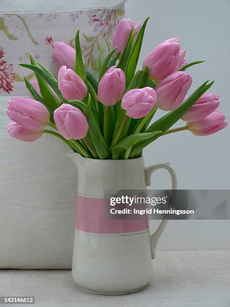 bunch of pink tulips in jug - ingrid henningsson stock pictures, royalty-free photos & images