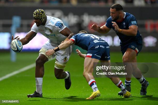Christ Tshiunza of Exeter Chiefs knocks under pressure from Richard Lane and Ellis Genge of Bristol Rugby during the Gallagher Premiership Rugby...