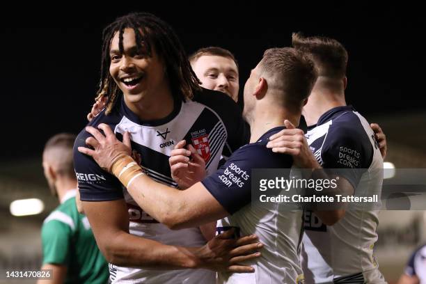 Joe Batchelor of England celebrates with team mate Dominic Young after scoring their sides fourth try during the International Friendly match between...