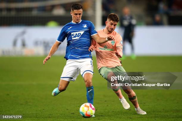 Christoph Baumgartner of Hoffenheim battles for the ball with Romano Schmid of Werder Bremen during the Bundesliga match between TSG Hoffenheim and...