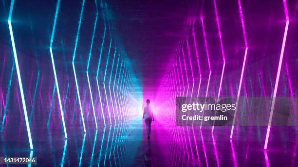 empty futuristic corridor with woman walking - focus for change stock pictures, royalty-free photos & images