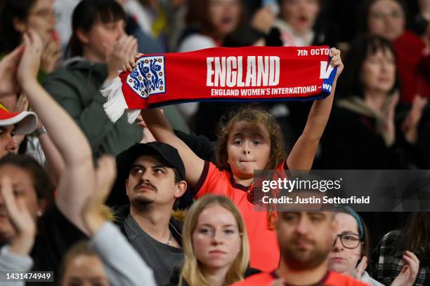 Young England fan shows their support with a scarf during the Women's International Friendly match between England and USA at Wembley Stadium on...