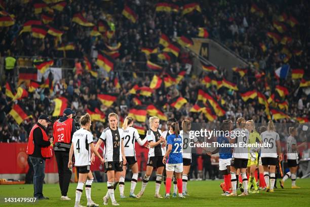 Players of Germany and France congratulate each other following the international friendly match between Germany Women's and France Women's at...