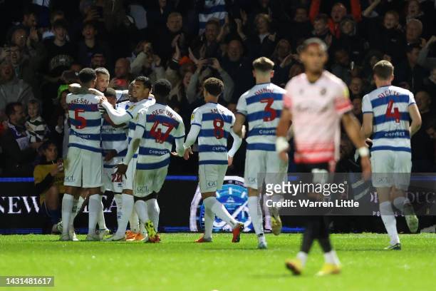 Lyndon Dykes of Queens Park Rangers celebrates with teammates after scoring their side's second goal during the Sky Bet Championship between Queens...