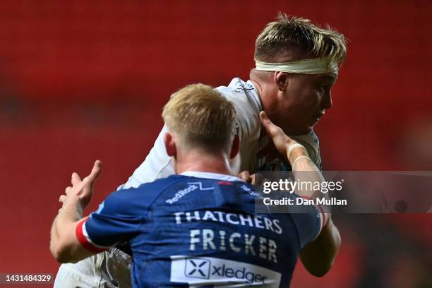 Richard Capstick of Exeter Chiefs gets past the tackle from Toby Fricker of Bristol Rugby during the Gallagher Premiership Rugby match between...